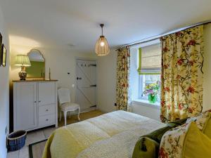 a bedroom with a bed and a window at 1 Bed in Hawick oc-91437 in Denholm