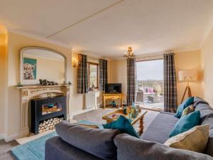 a living room with a couch and a fireplace at 1 Bed in Northwich oc-91266 in Whitegate