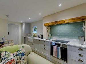 a kitchen with white cabinets and a counter top at 1 Bed in Hawick oc-91437 in Denholm
