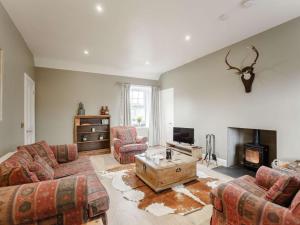 a living room with two couches and a fireplace at 2 Bed in Duns oc-82759 in Duns