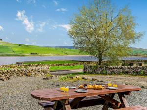 a wooden picnic table with a tray of fruit on it at 2 Bed in Barnard Castle oc-90498 in Middleton in Teesdale