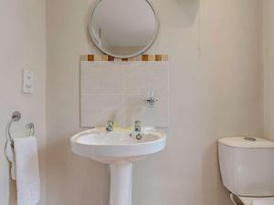 a white bathroom with a sink and a mirror at 2 Bed in Barnard Castle oc-90498 in Middleton in Teesdale +23 photos
