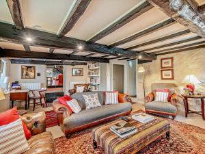 a living room with a couch and a table at 4 Bed in Kendal oc-sz535 in Kentmere
