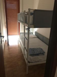 two bunk beds in a room with a hallway at casa vacanze da Tony 2 in San Benedetto del Tronto