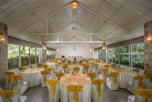 a large banquet hall with tables and chairs at Blanket Riverside Resort and Spa in Munnar +98 photos