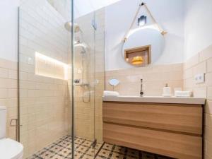 a bathroom with a shower and a sink and a mirror at Can montis in Palma de Mallorca +42 photos