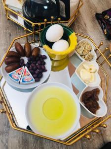 a tray of food with eggs and other ingredients at Dar Mariem Douz in Douz