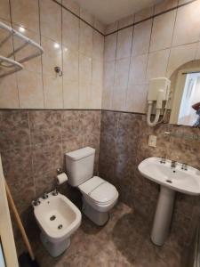 a bathroom with a toilet and a sink at Lido in Mar del Plata