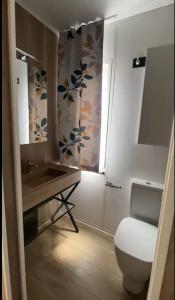 a bathroom with a toilet and a sink at Camping 4 Cerchi Ecogreen in Lido di Fermo