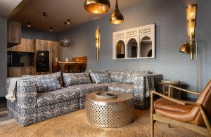 a living room with a couch and a table at Sanctuary Knocker in Durham