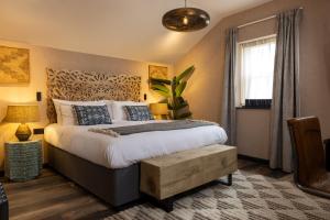 a bedroom with a large bed and a window at Sanctuary Knocker in Durham