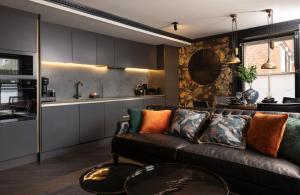 a living room with a couch and a kitchen at Sanctuary Knocker in Durham +33 photos