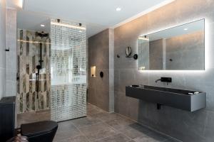 a bathroom with a sink and a shower at Sanctuary Knocker in Durham
