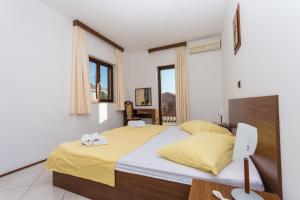 Posteľ alebo postele v izbe v ubytovaní Villa Katarina