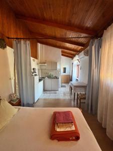 a bedroom with a bed and a kitchen in a room at Apartman Mira in Karlobag +26 photos