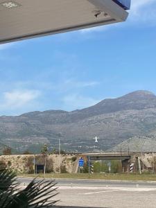 a view of a road with mountains in the background at Kokaj3B in Hani Hotit
