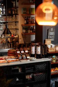 a counter in a store with food on it at HotelO Kathedral in Antwerp +74 photos