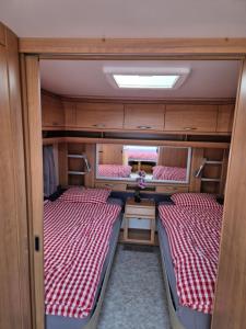 a room with two bunk beds in a room at La Bordu in Grandson