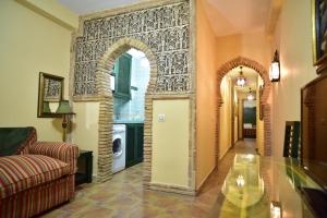 Posedenie v ubytovaní Apartamentos Boutique Doña Maria La Brava
