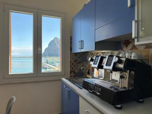 a kitchen with a coffee machine on a counter at Il vecchio e il mare in San Vito lo Capo