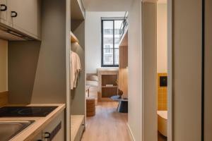 a small kitchen with a sink and a bathroom at Leon by Zoia Living in Piraeus +213 photos