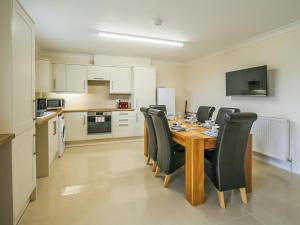 a kitchen and dining room with a table and chairs at 1 Dawson Court - Uk33410 in Mablethorpe