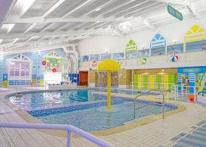 a large swimming pool with a water park at Unity Skirlington Coast Yorkshire in Ulrome