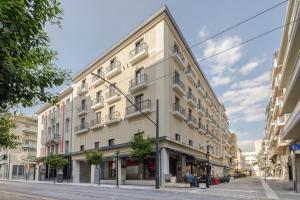 a large white building on a city street at Leon by Zoia Living in Piraeus