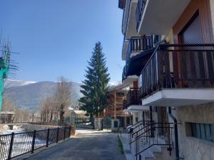a street in a town with a mountain in the background at Casa Vacanze Limone in Limone Piemonte