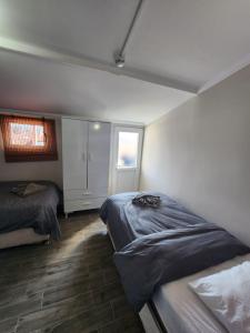 a bedroom with two beds and a window at Şehzade Apart Otel in Fethiye +16 photos