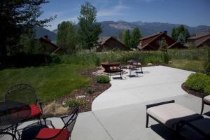 a group of chairs and tables on a patio at Powder Mtn Wolf Den TR11Mtn Biking Dog Friendly in Eden