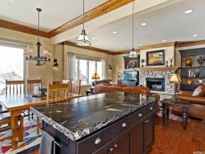a kitchen and living room with a large island at Powder Mtn Wolf Den TR11Mtn Biking Dog Friendly in Eden +26 photos