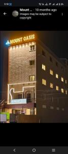 a building with a sign that reads mount oasis at MOUNT OASIS RESIDENCY Tiruvannamalai in Tiruvannāmalai
