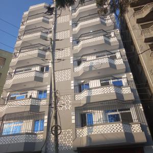 a building with balconies on the side of it at Classic Studio Bamburi in Mombasa