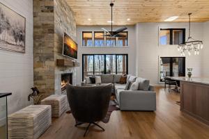 a living room with a couch and a fireplace at Timber Haven in Blue Ridge