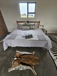 a bedroom with a large bed with a wolf cut out on it at Troupant - Luxury Bush Unit in Askham
