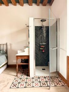a glass shower in a bathroom with a sink at Former riverside rectory in Nanteau-sur-Lunain +42 photos