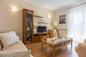 a living room with a couch and a coffee table at Villa Sofia with Private Pool in Pazin