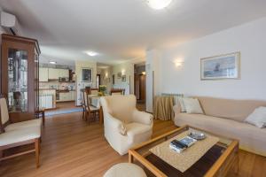 a living room with a couch and a table at Villa Sofia with Private Pool in Pazin