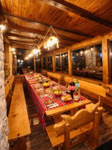 a long dining room with a long table with food at ng royal in Rakitovo