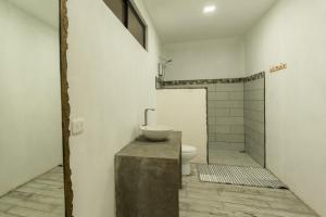 a bathroom with a sink and a toilet at Catalinas Cozy Room in Fortuna
