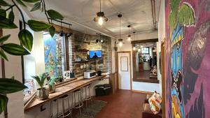 a room with a long counter in a store at Cwmcarn Hotel & Bunkhouse in Cwmcarn