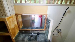 an overhead view of a shower in a bathroom at Bungalow Bleu Villa Luna Nosy Be in Nosy Be