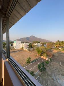 a view from a window of a parking lot at VV Guest House & Rooms in Tiruvannāmalai