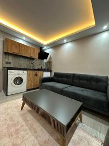 a living room with a couch and a table at Tree Rose Suite in Uzungöl