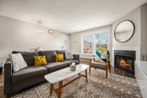 a living room with a couch and a fireplace at Powder Peak Hideaway WL203 Ski Escape Hot Tub in Eden