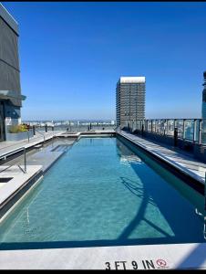 a swimming pool with the beach in the background at 501 First Residences Miami in Miami