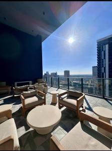 a living room with a view of a city skyline at 501 First Residences Miami in Miami