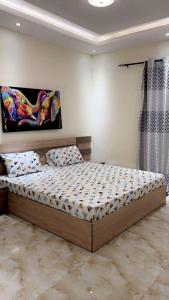 a bedroom with a bed in a room at Daryl House Liberte 2 in Dakar +5 photos