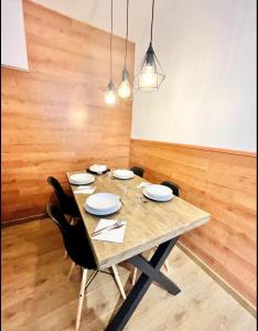 a dining room with a wooden table and chairs at Estavar in Estavar +1 photo